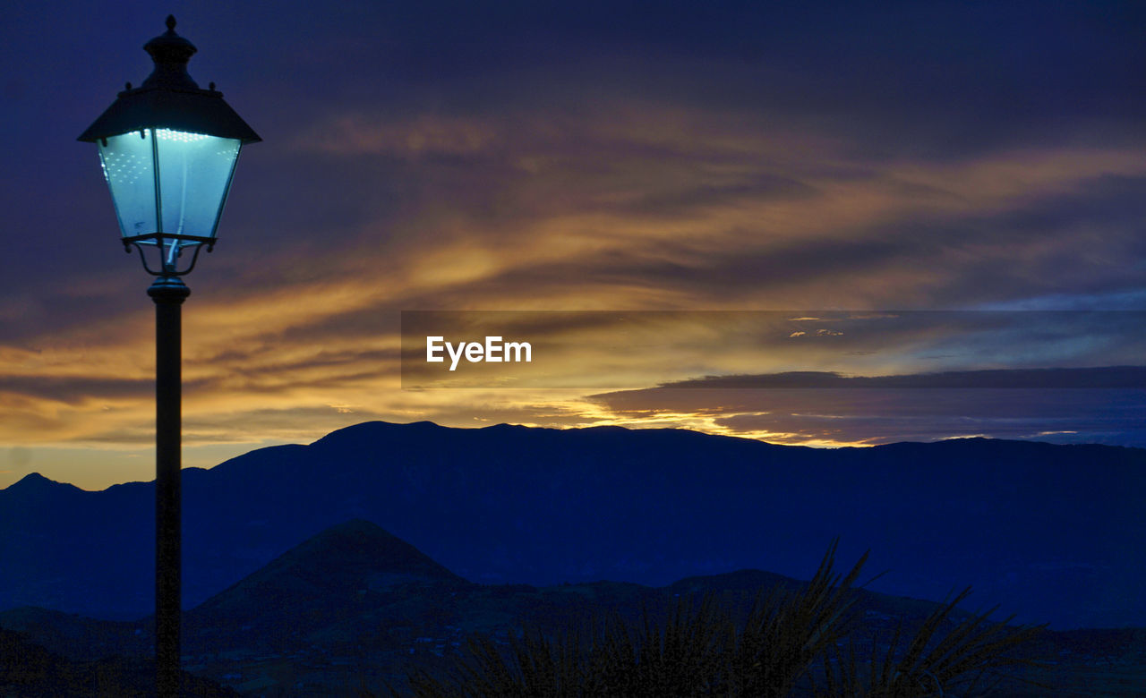 Low angle view of silhouette mountain against sky during sunset