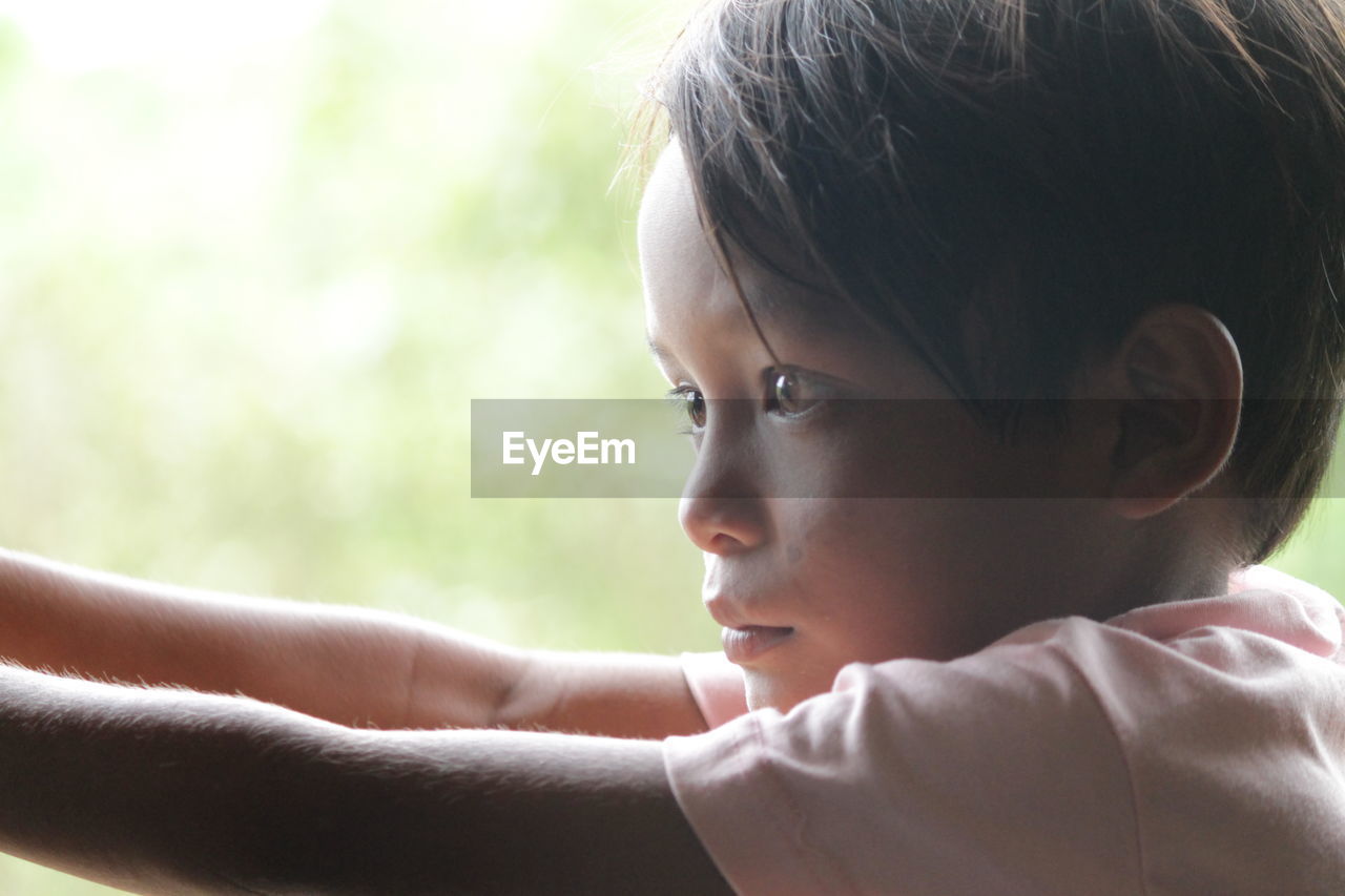 CLOSE-UP OF BOY WITH EYES