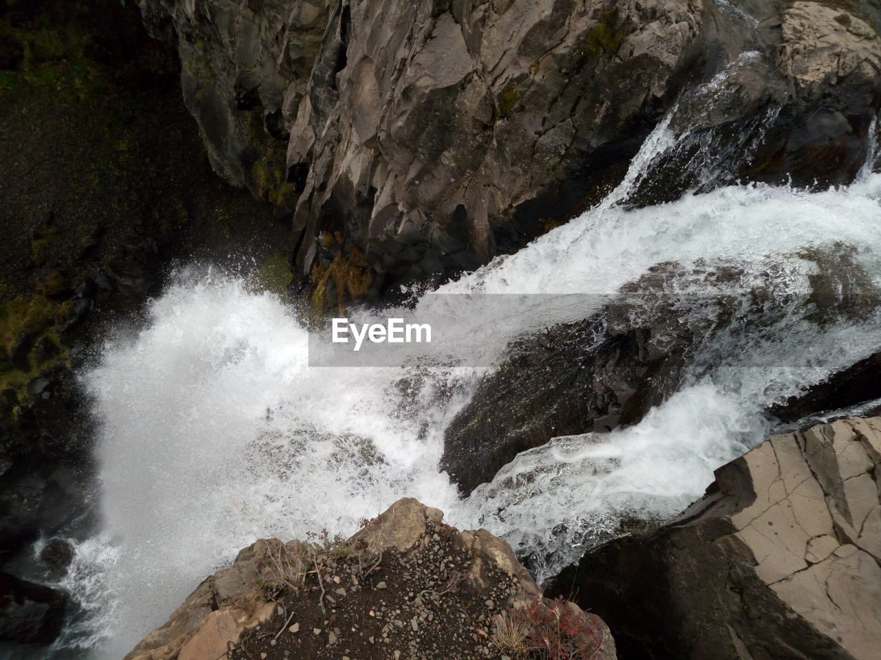 WATER SPLASHING ON ROCKS