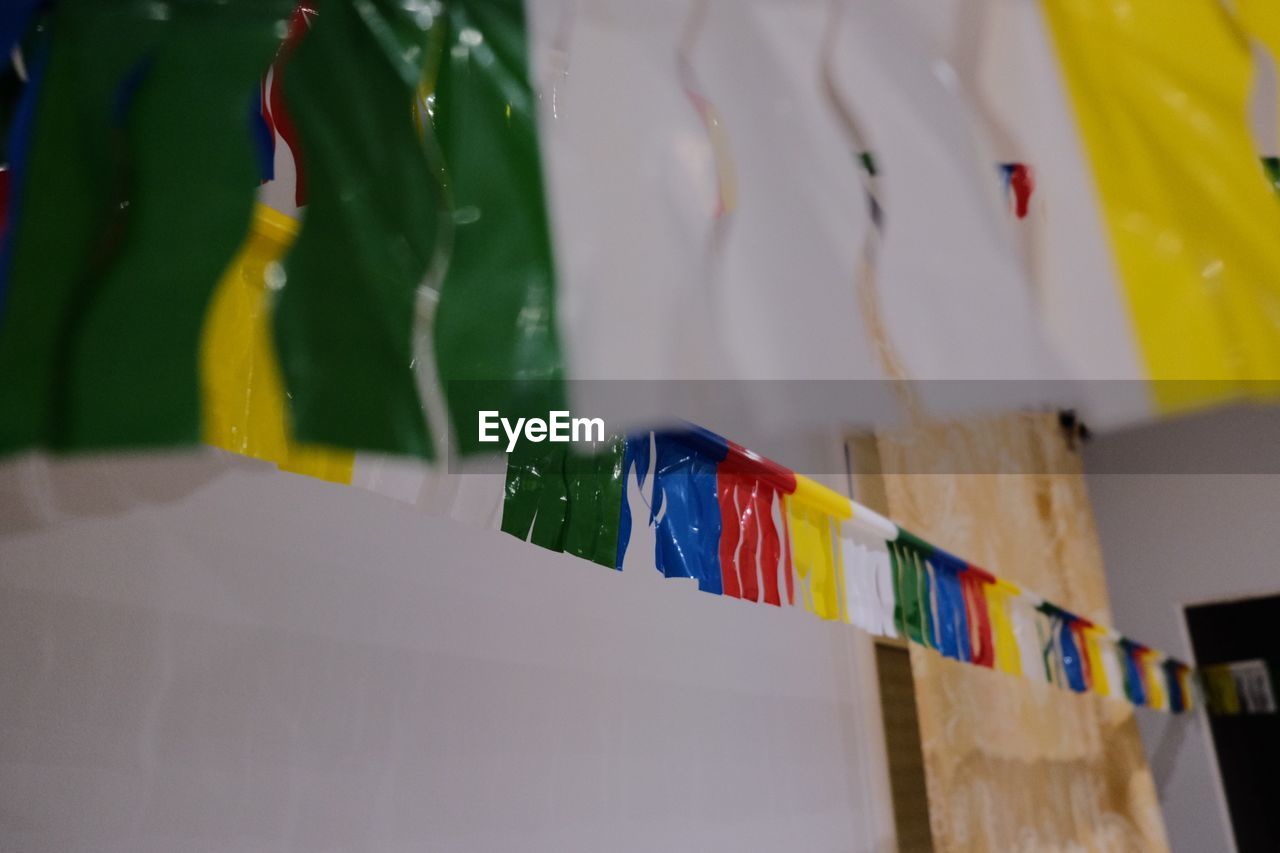 Close-up of colorful flags hanging