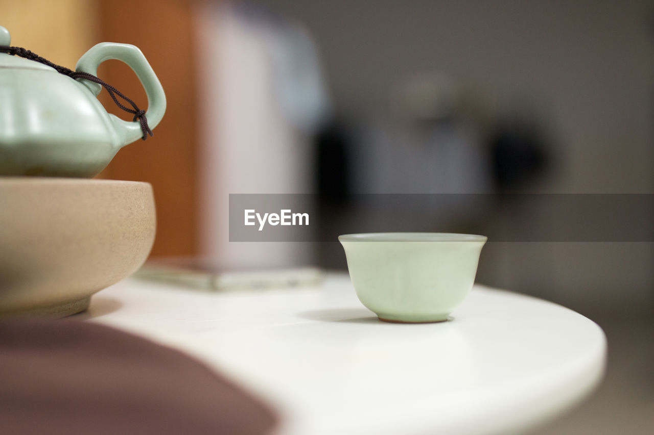 Close-up of cup on table at home