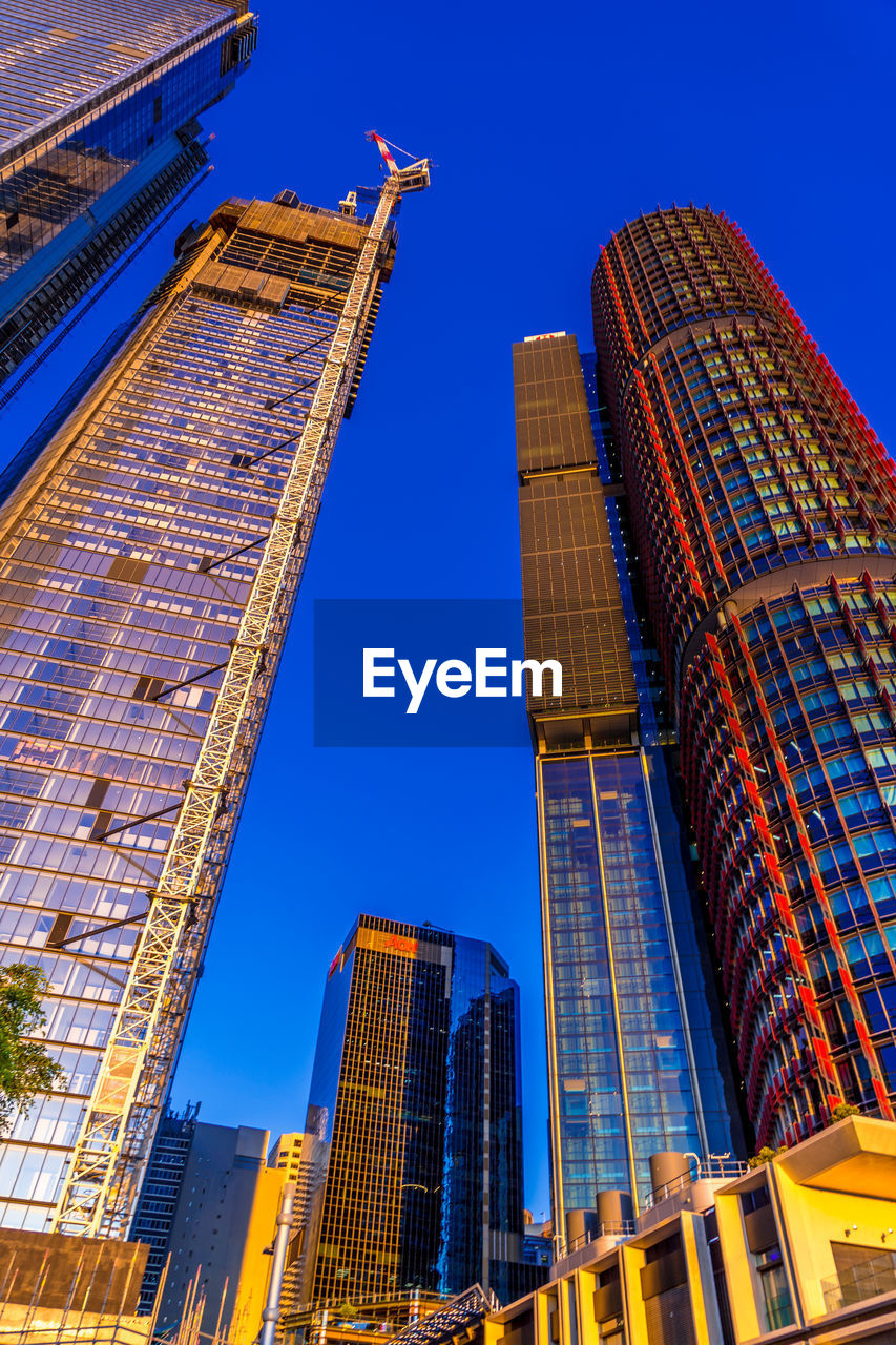 low angle view of skyscrapers against clear sky