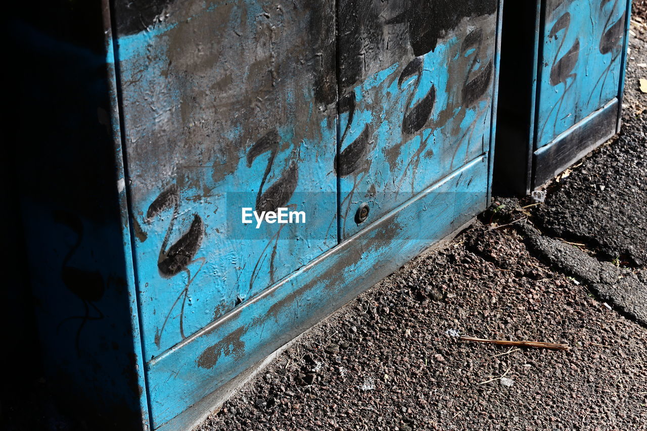 GRAFFITI ON WALL OF OLD ABANDONED BUILDING