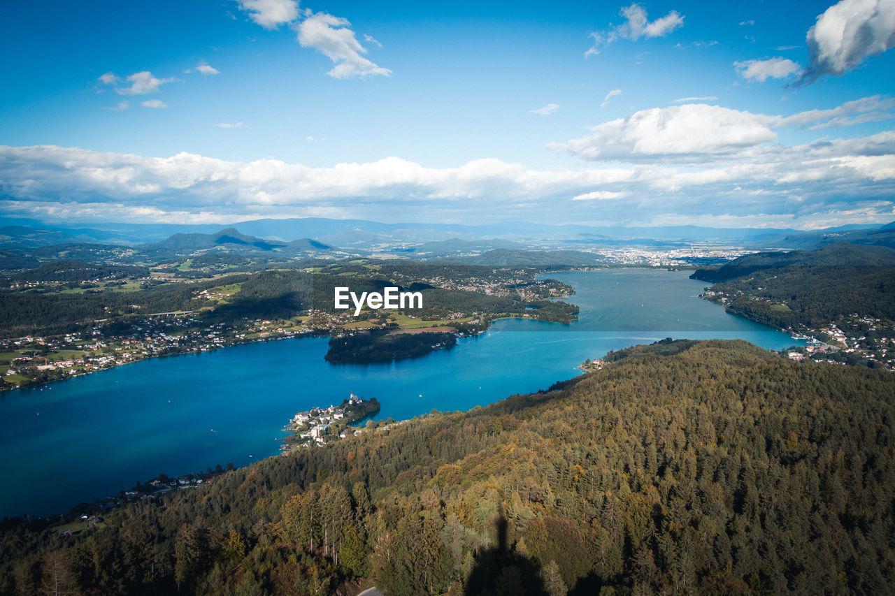 Aerial view of sea and town against sky