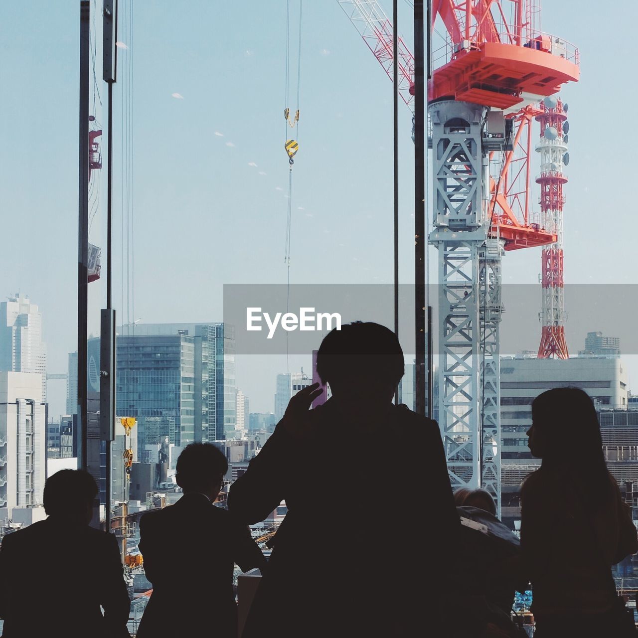 WOMAN LOOKING AT CITY