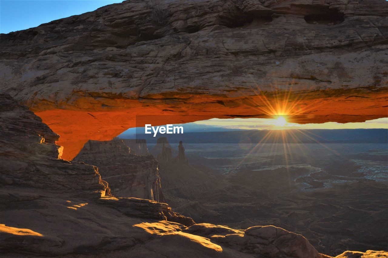 Scenic view of canyon against sky during sunset