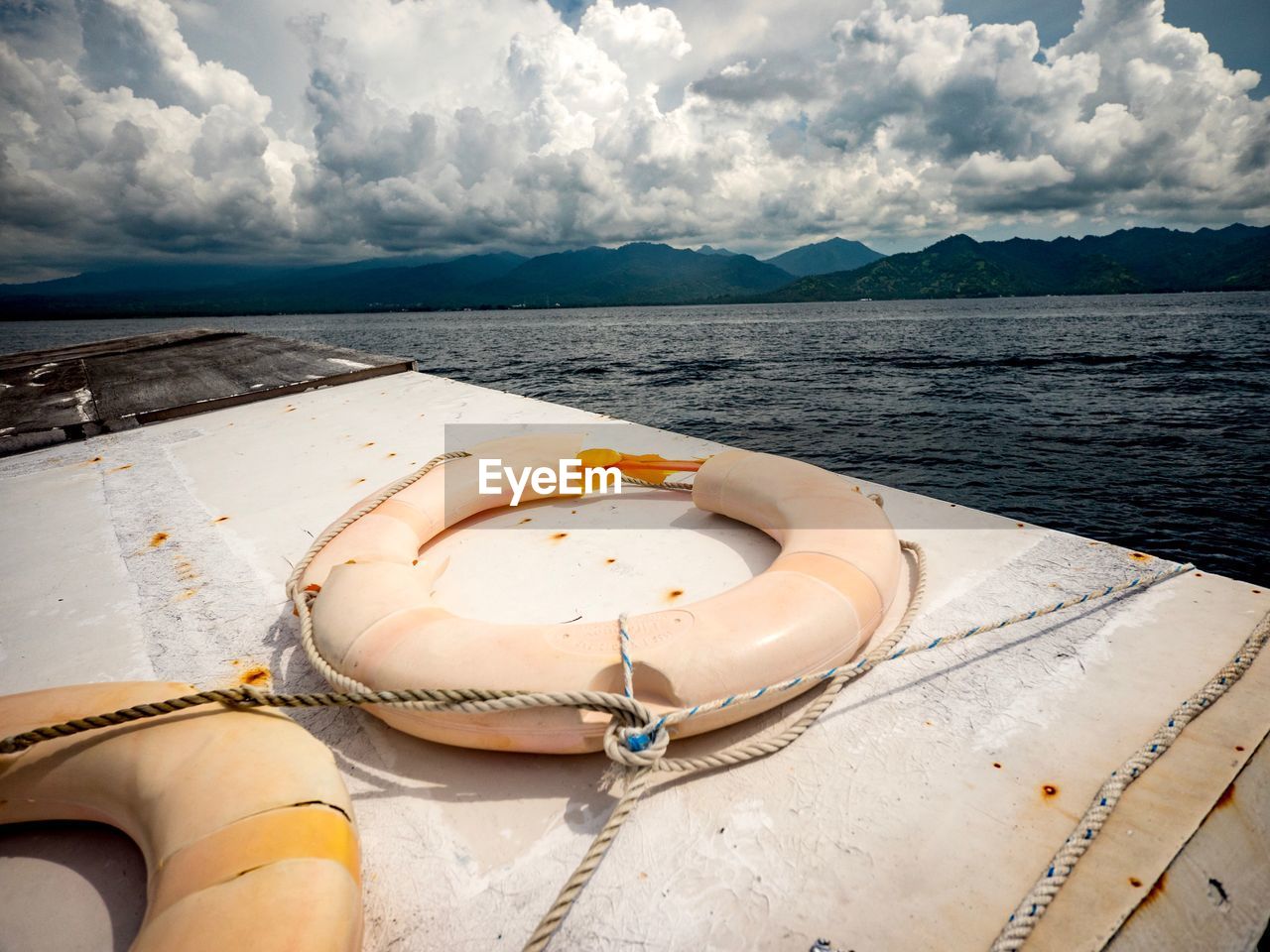 BOAT ON SHORE AGAINST SKY