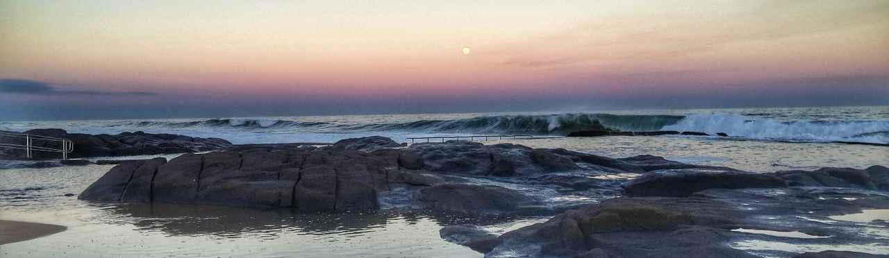 VIEW OF SEA AT SUNSET