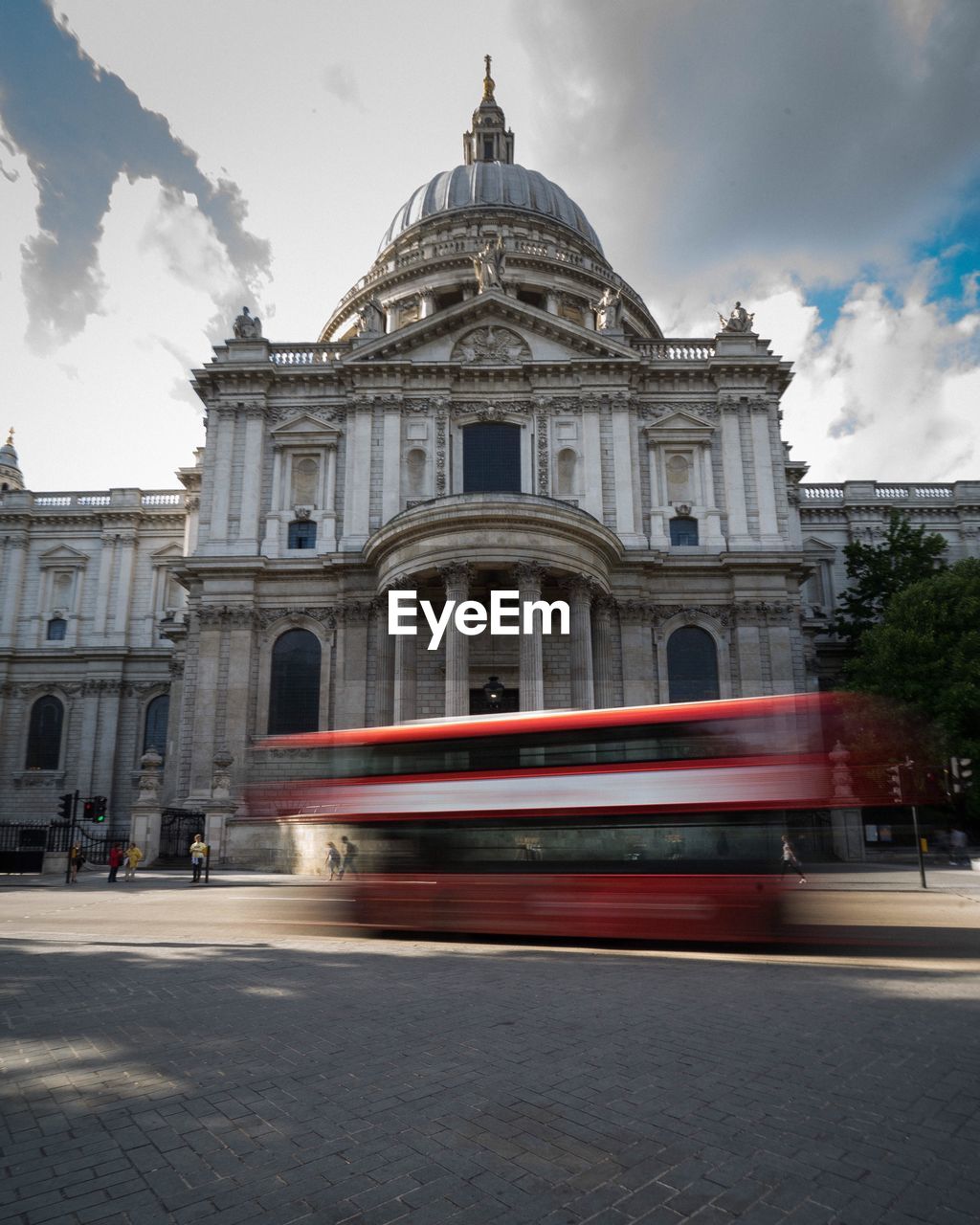 Blurred motion of bus on road against st paul cathedral