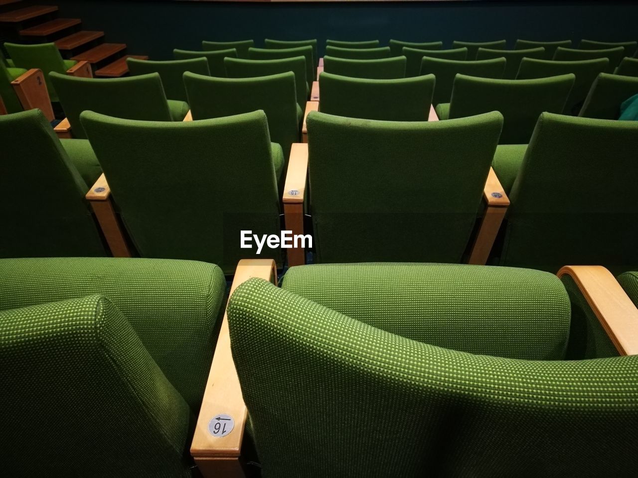 High angle view of empty chairs in auditorium