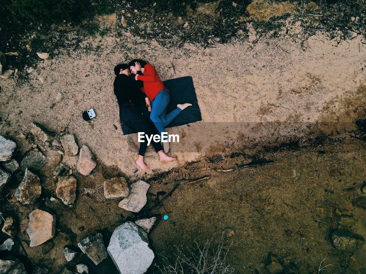 High angle view of a couple on the beach