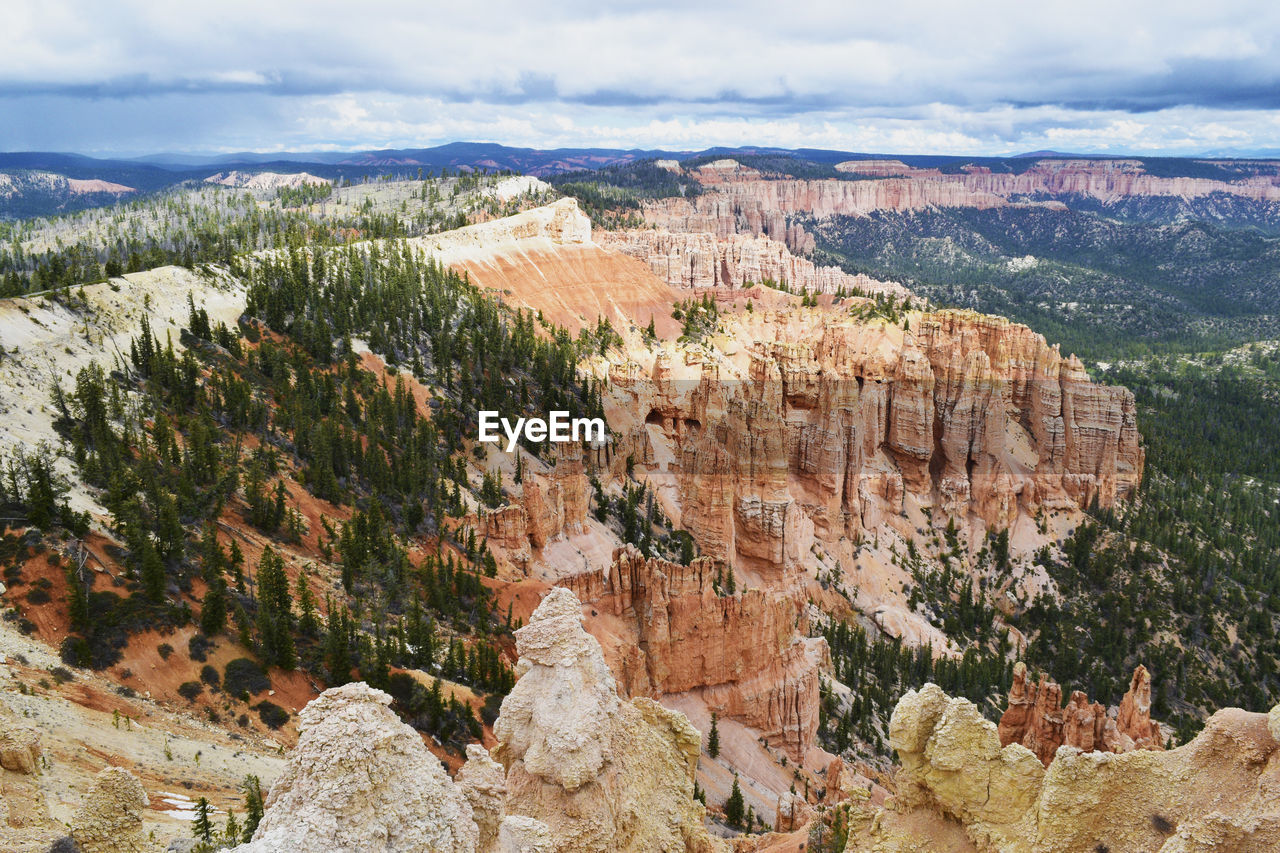 Rock formations at bryce canyon national park against cloudy sky