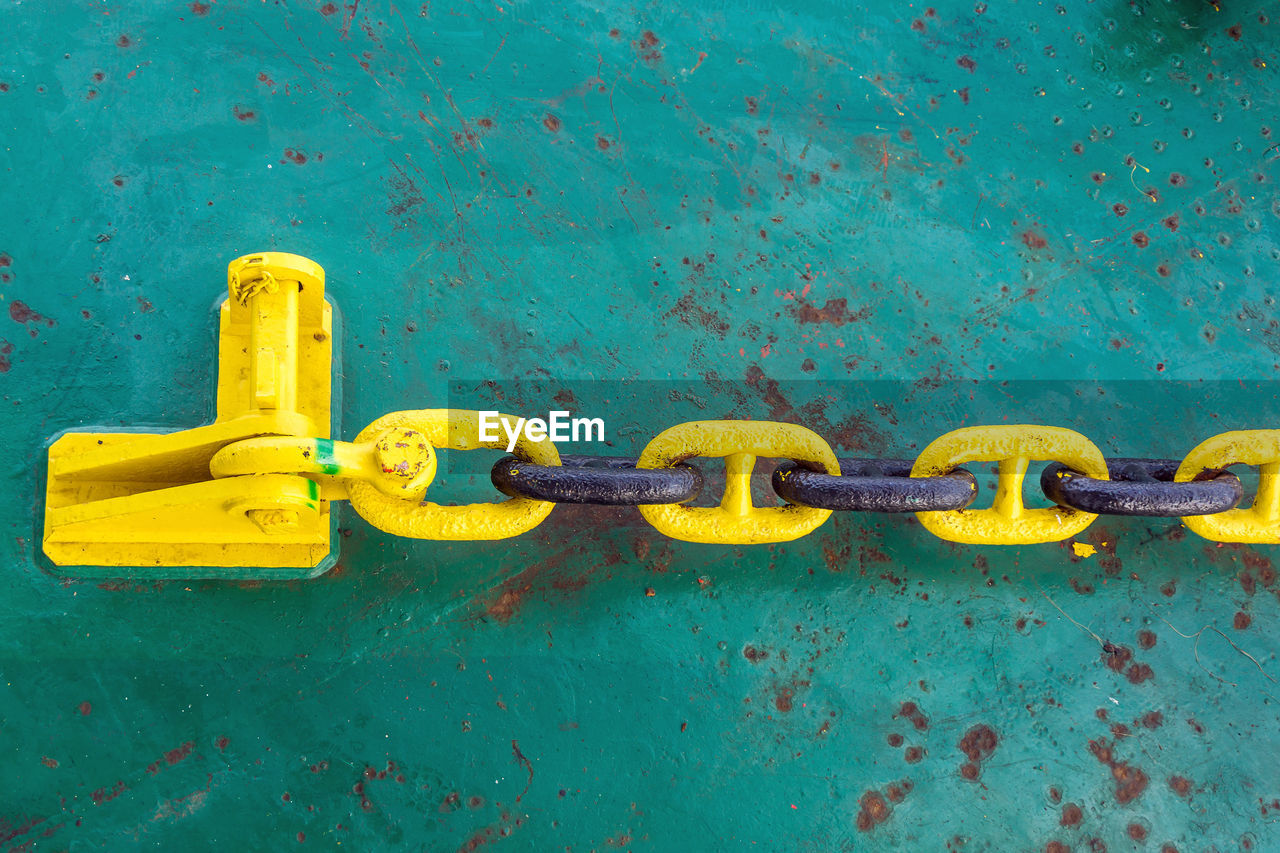 Mooring anchor chain secured to a stopper pin on board a construction barge at offshore oil field