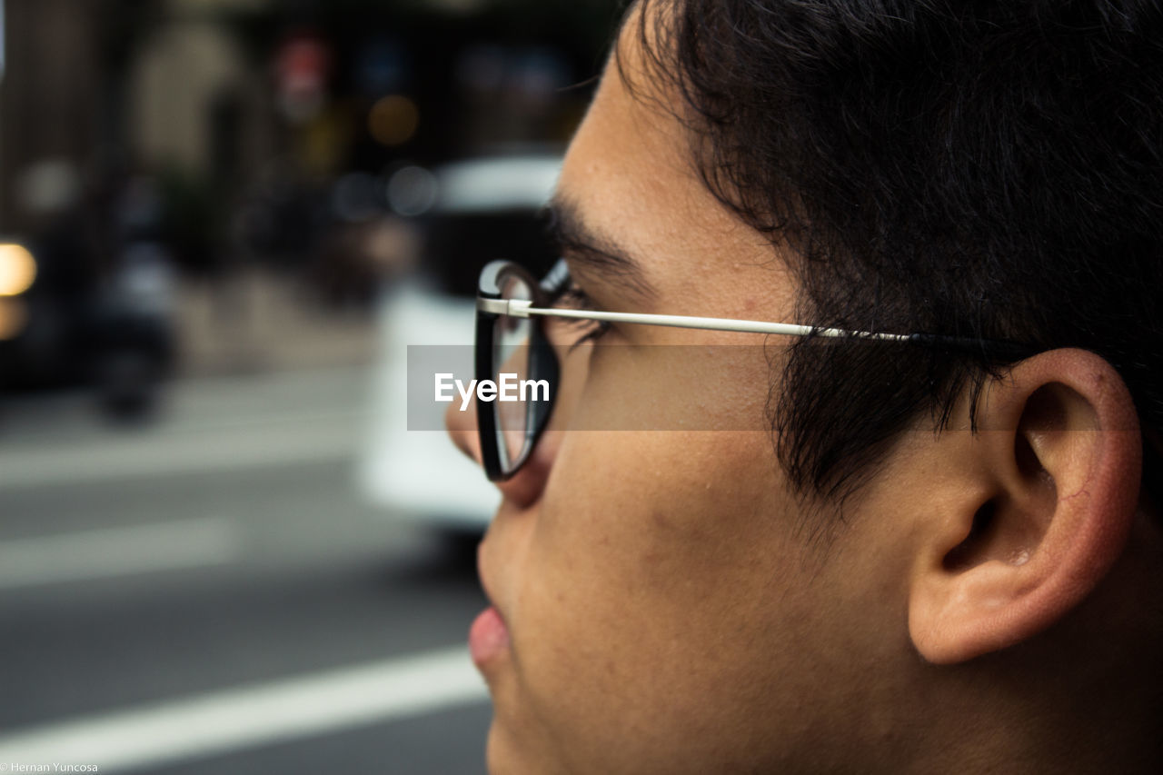 Close-up of young man wearing eyeglasses