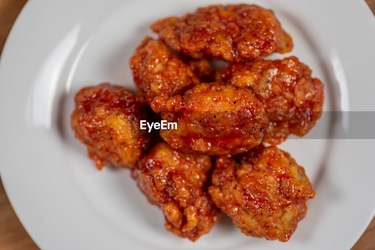 Plate of spicy hot boneless bbq chicken wings