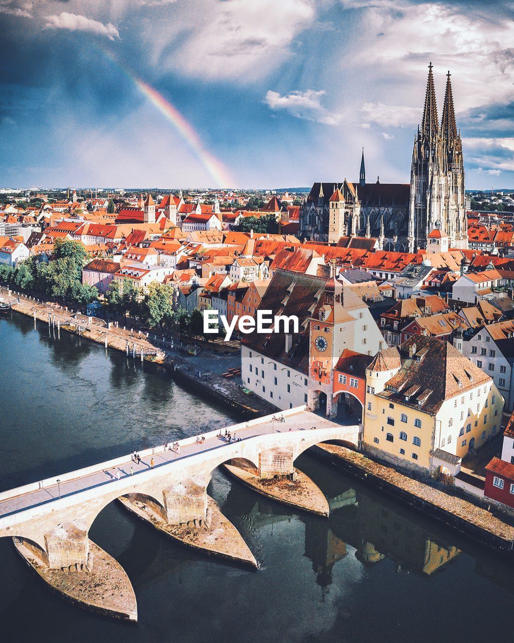 Aerial view of buildings in town against sky