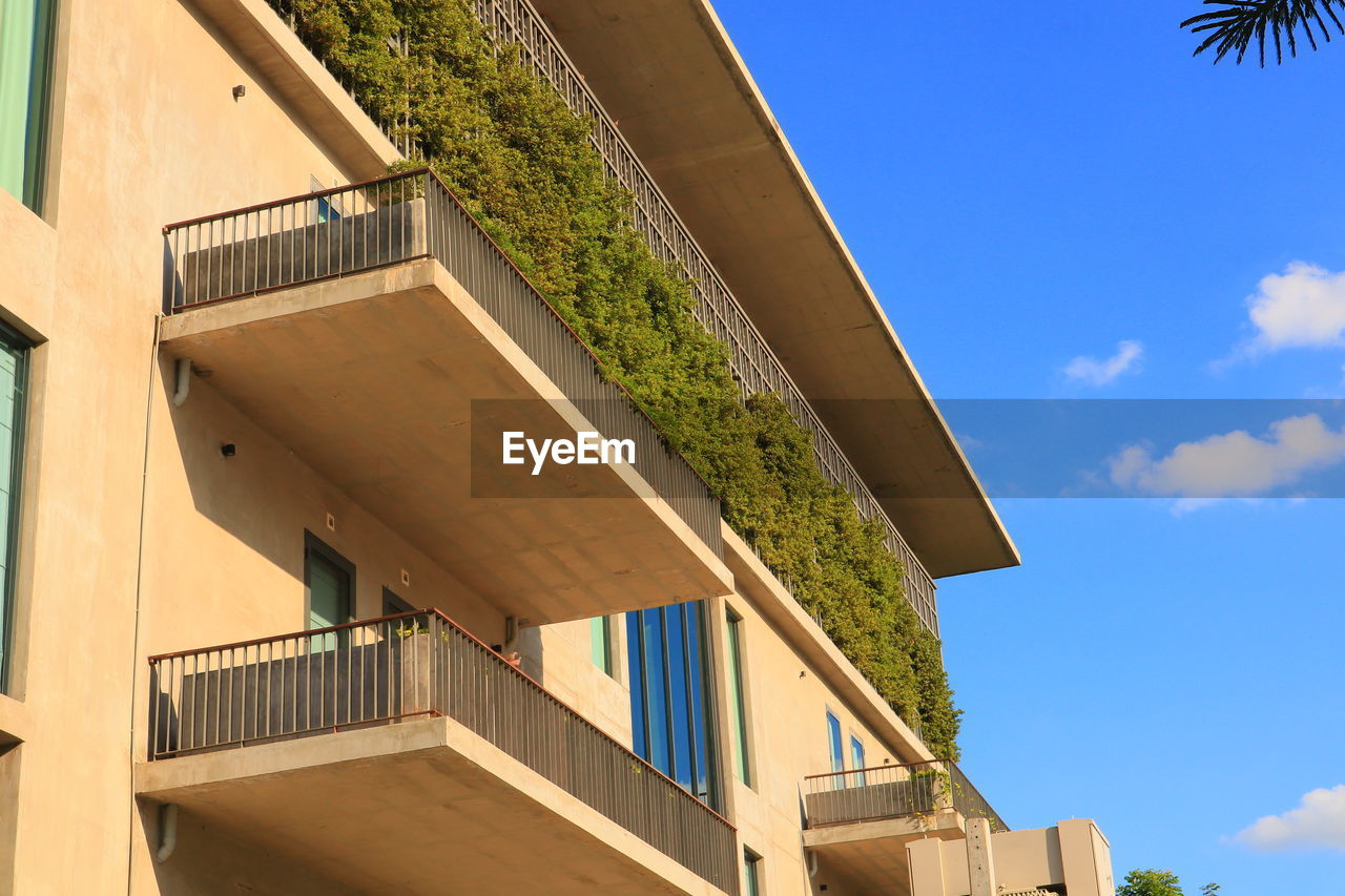 Low angle view of balconies of  the apartment against sky,  residential building concept. 