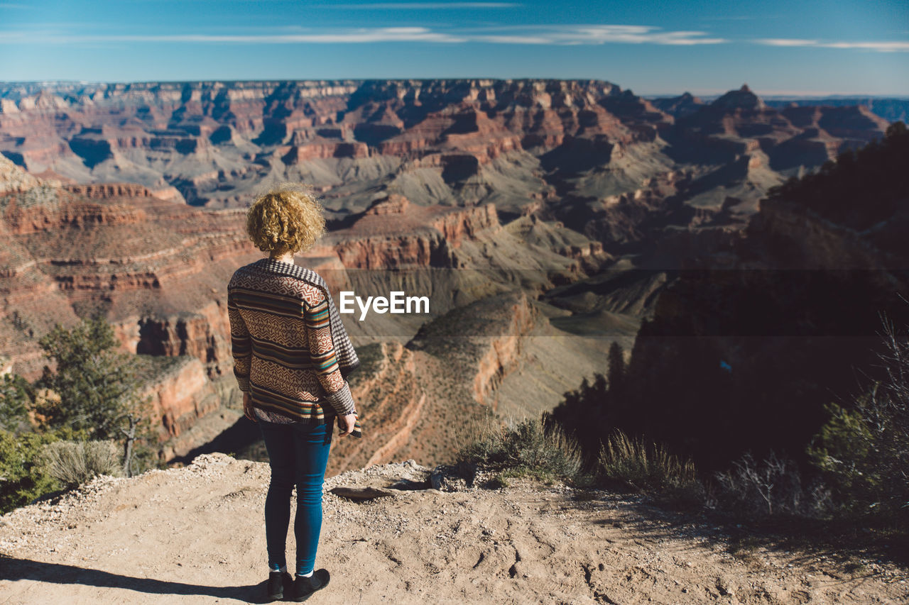 Rear view of woman looking at grand canyon