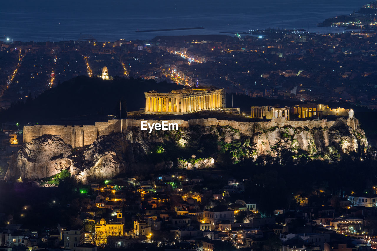 Aerial view of illuminated buildings in city