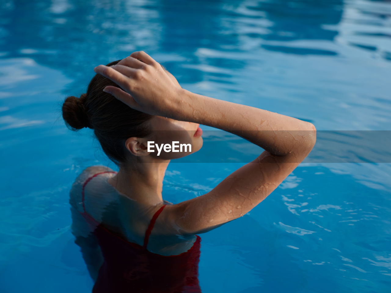 High angle view of woman swimming in pool