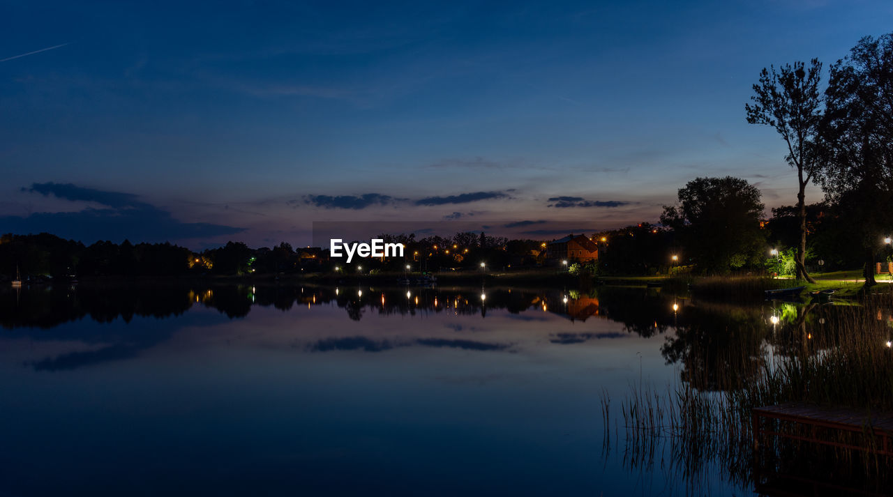 SCENIC VIEW OF LAKE AT NIGHT