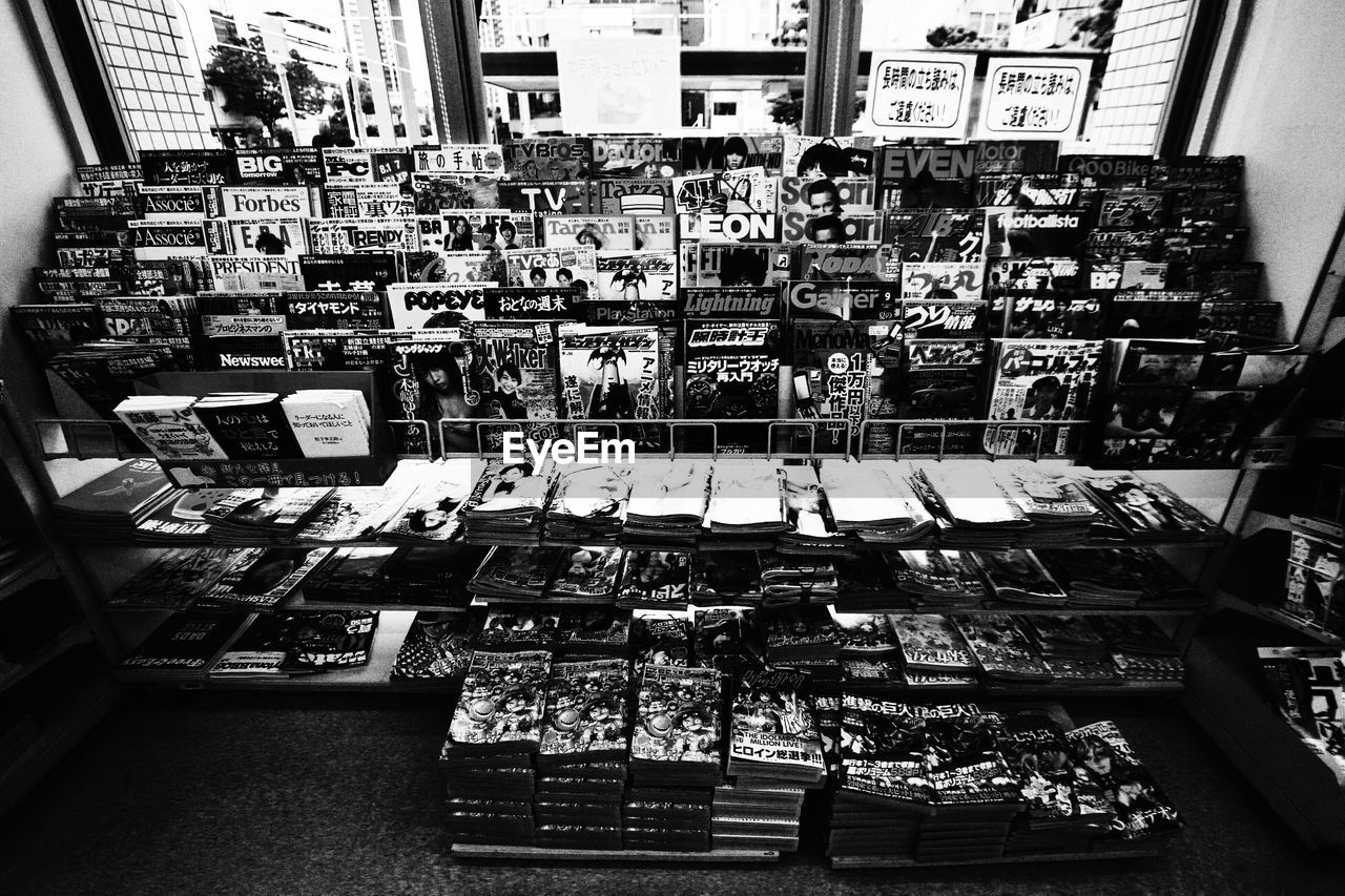 High angle view of books on shelves at store