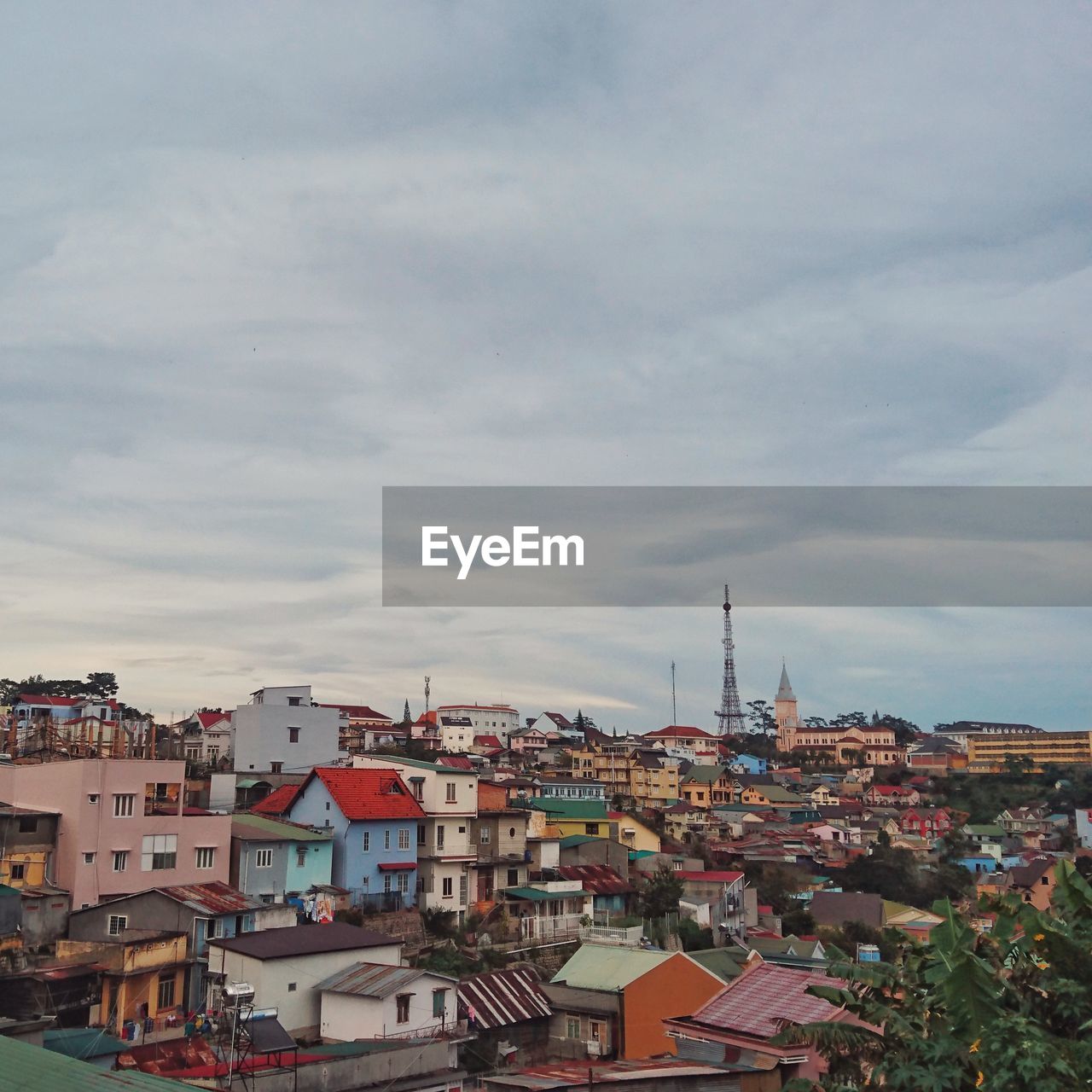 Cityscape against cloudy sky