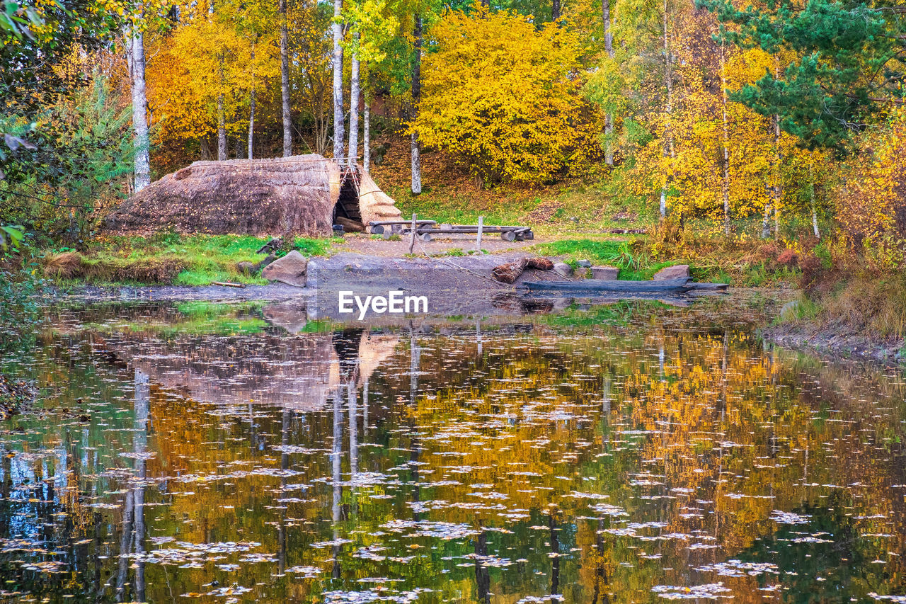 Reconstructed ancient civilizations village at a lake