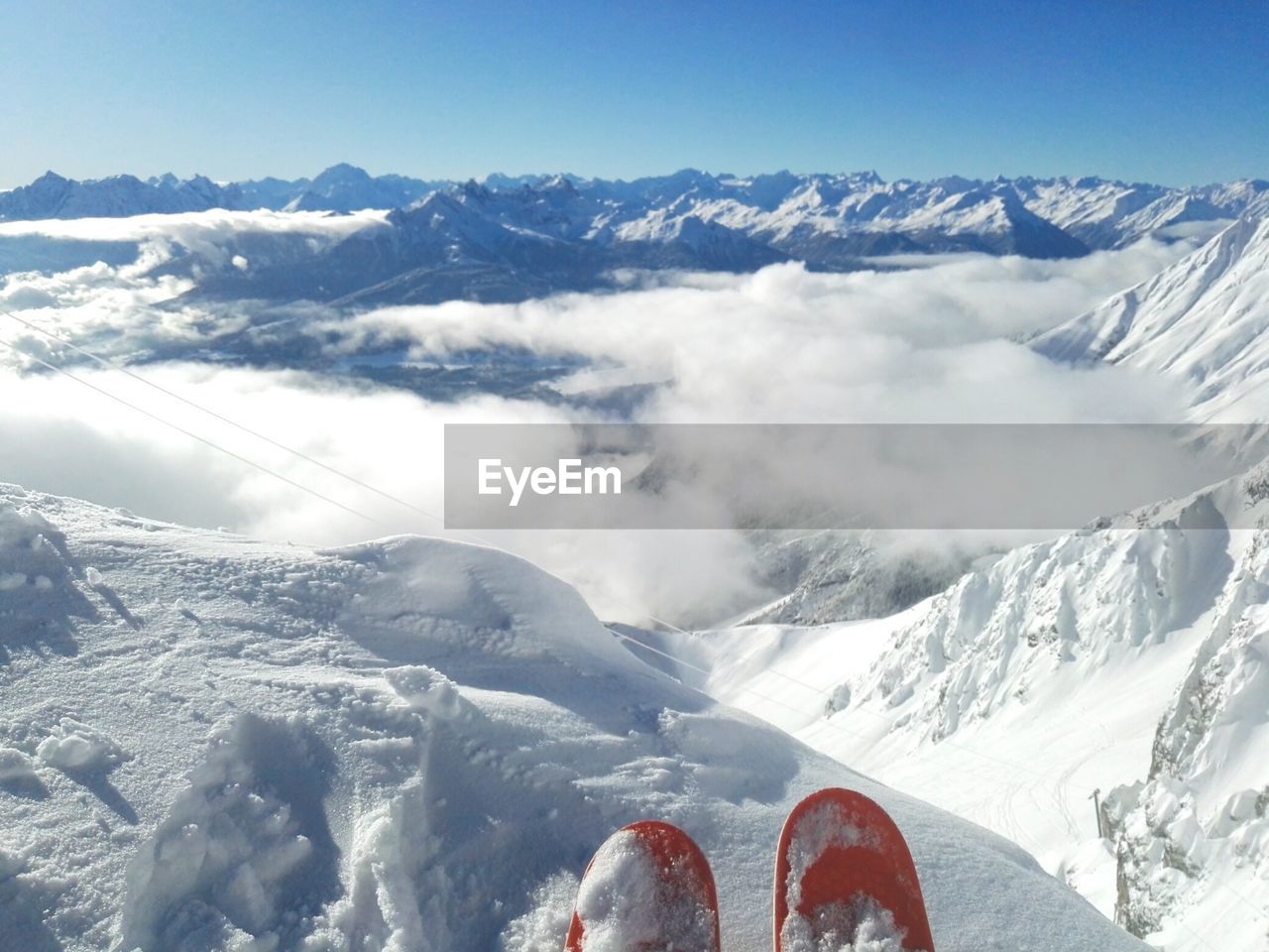 SNOW COVERED MOUNTAINS AGAINST SKY