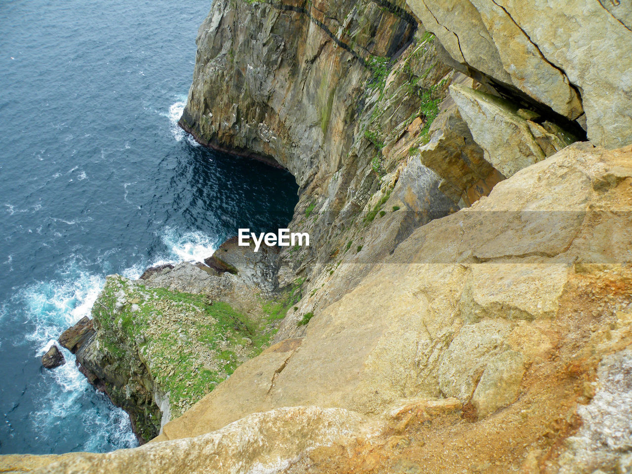 High angle view of cliff at sea shore