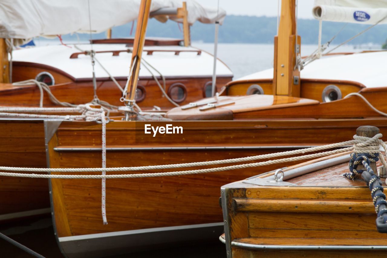 Wooden boats moored in river