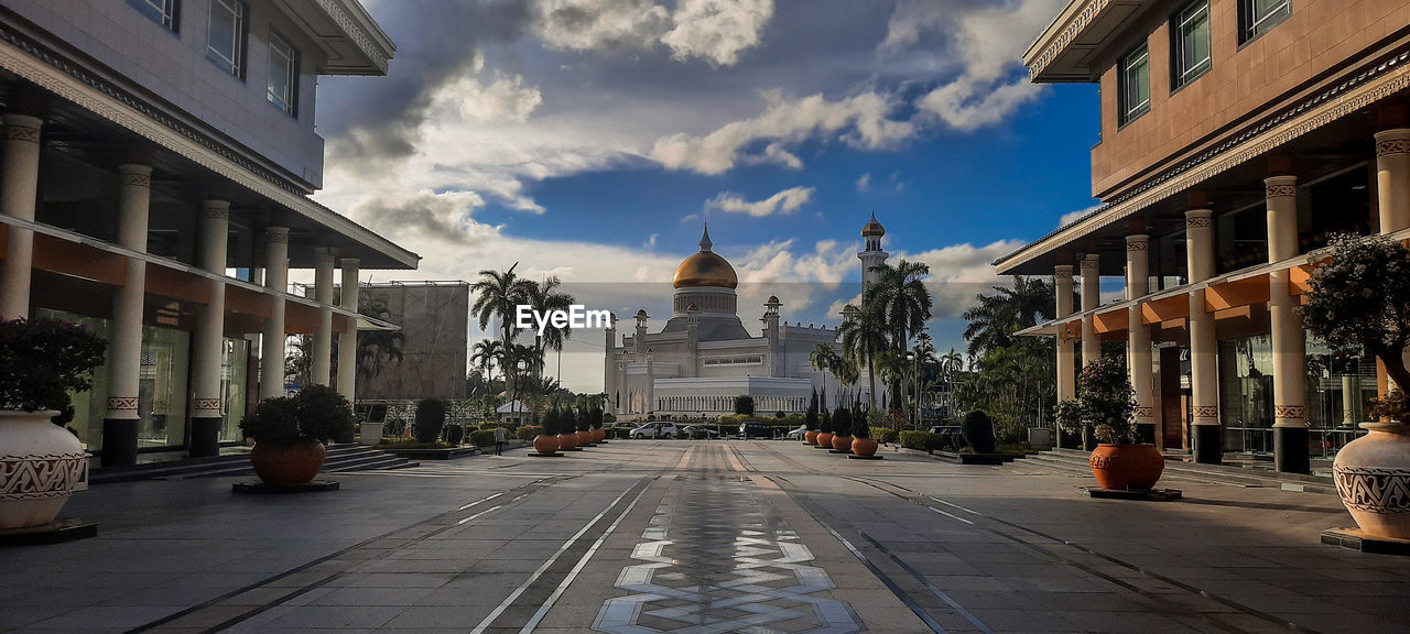 Panoramic view of buildings in city against sky