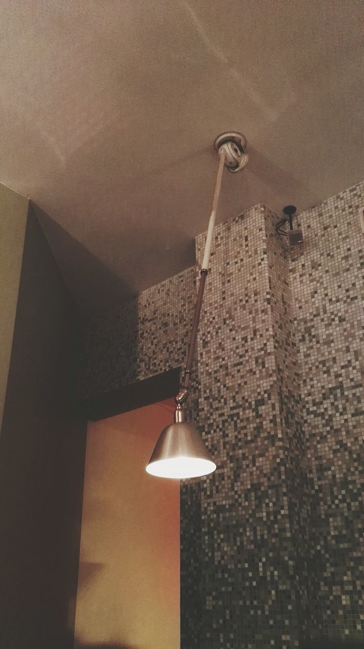 LOW ANGLE VIEW OF ELECTRIC LAMP HANGING ON FLOOR