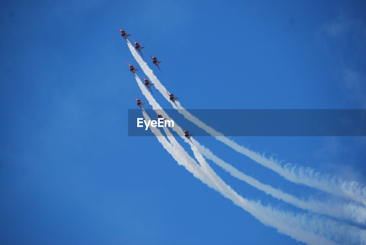 Fighter planes performing airshow in sky