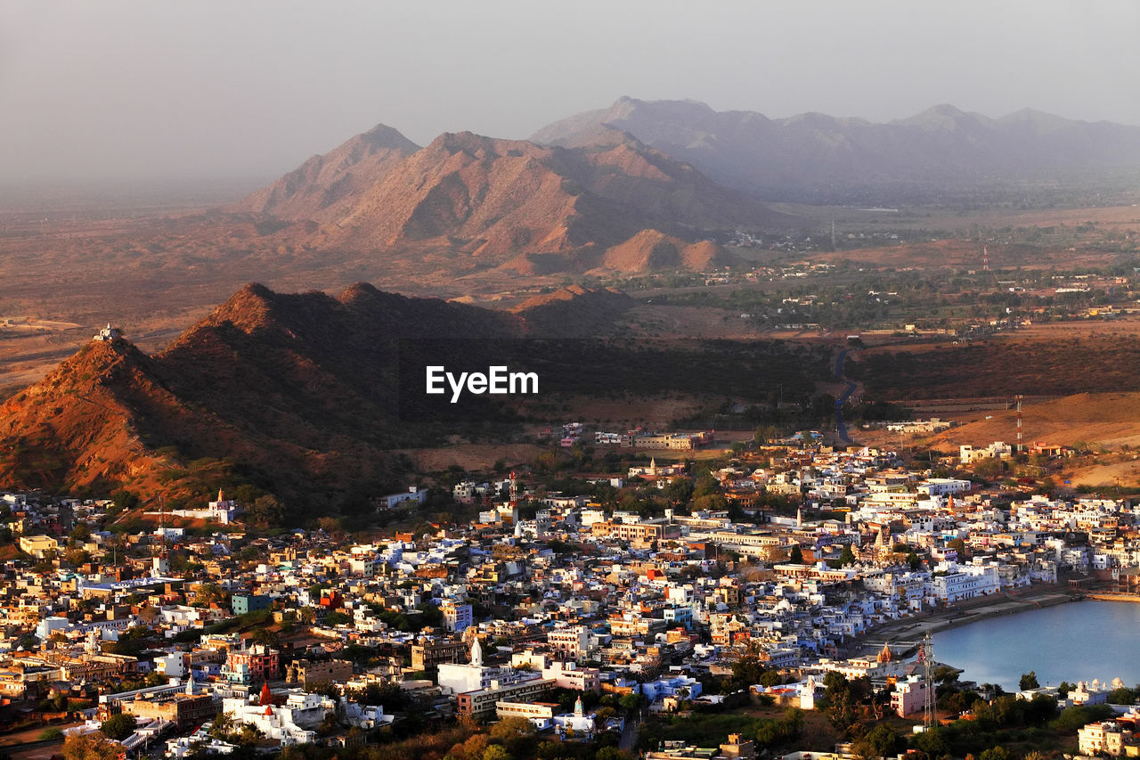 High angle view of residential district and mountains