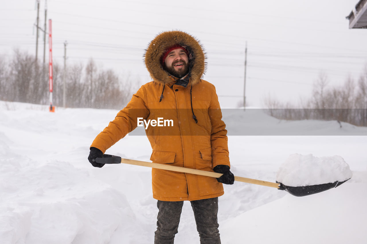 low angle view of man standing on snow
