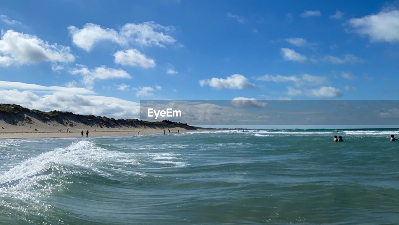 PANORAMIC VIEW OF BEACH AGAINST SKY