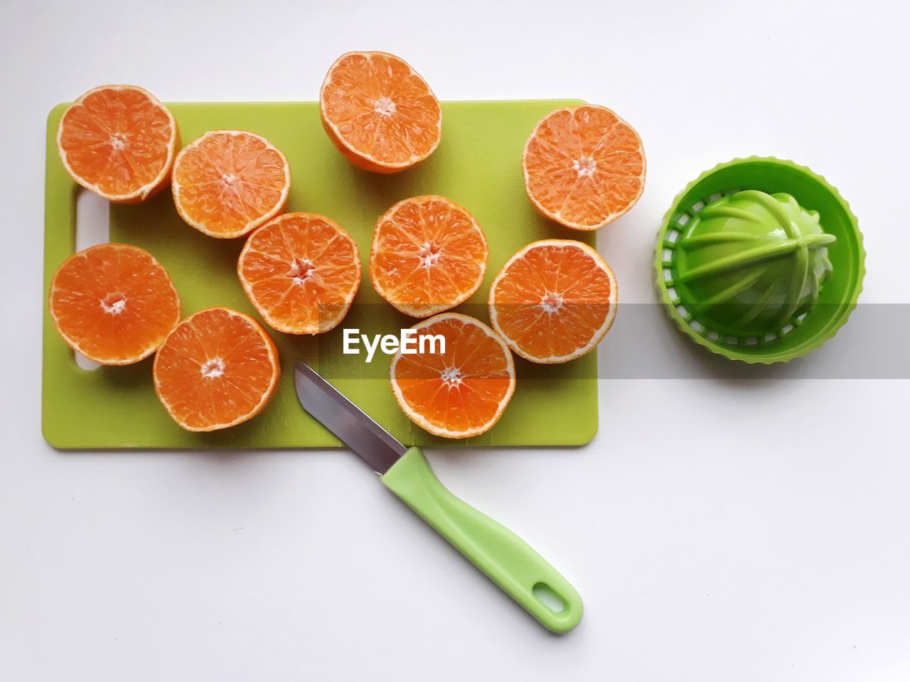 High angle view of orange fruits on cutting board