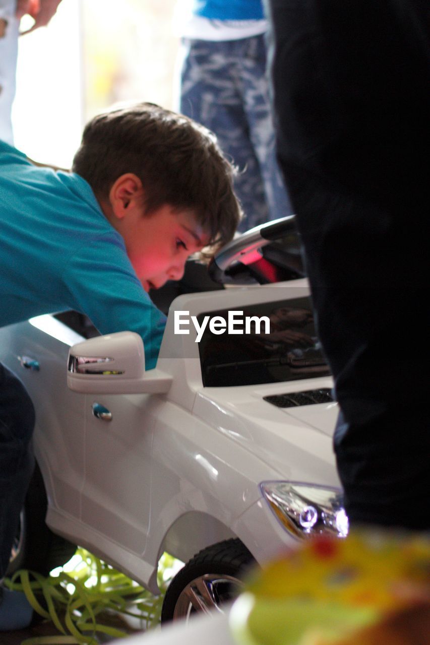 CLOSE-UP OF CUTE BOY STANDING ON CAMERA