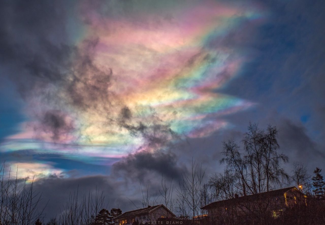 LOW ANGLE VIEW OF RAINBOW IN SKY