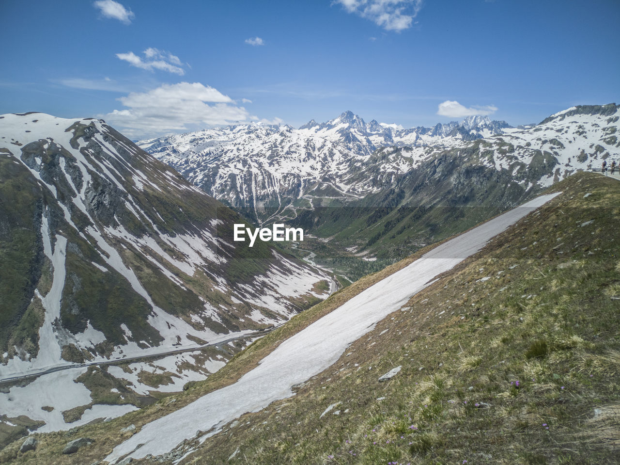 SNOW COVERED MOUNTAIN AGAINST SKY