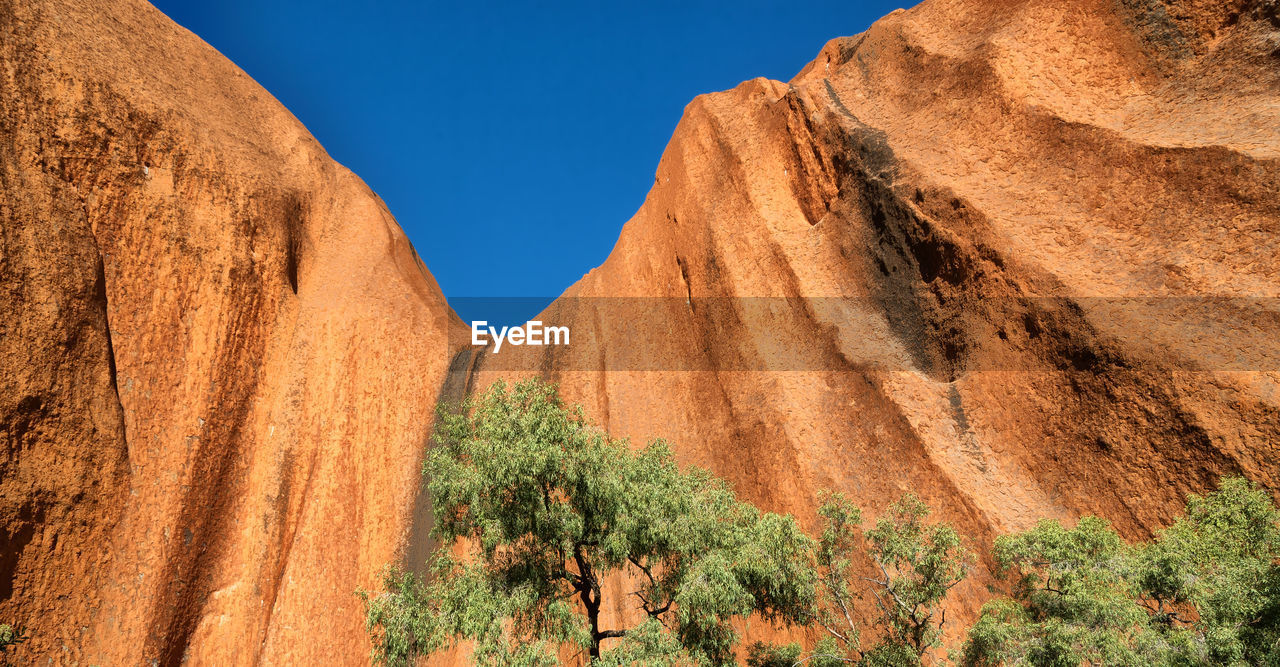 Scenic view of rock formations in desert against sky