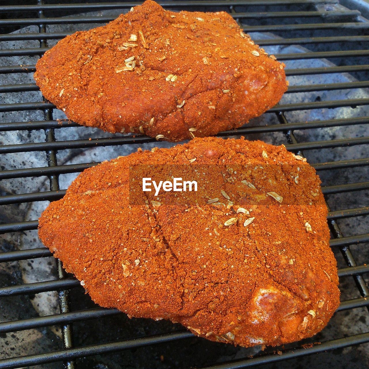 High angle view of meat on barbecue grill