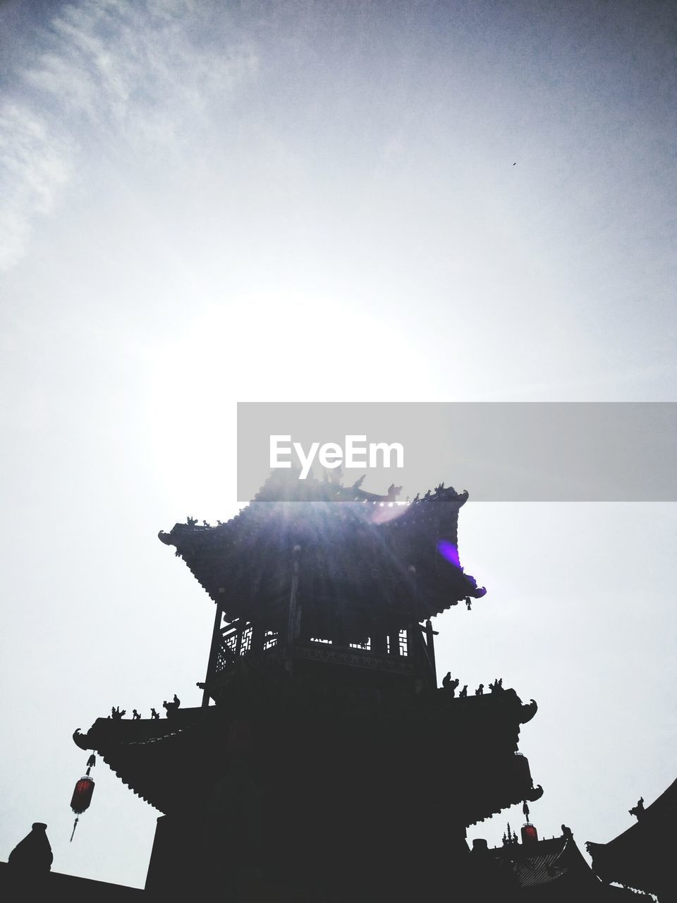 LOW ANGLE VIEW OF SILHOUETTE STATUES AGAINST SKY