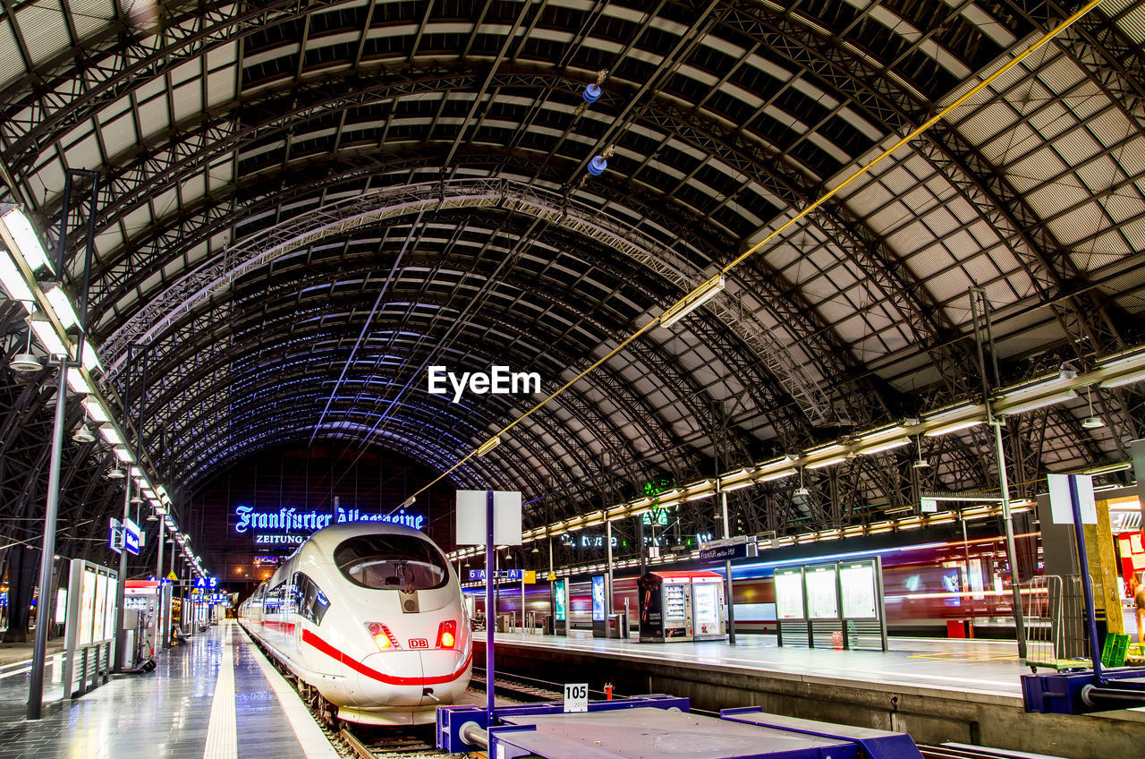 TRAIN AT ILLUMINATED RAILROAD STATION