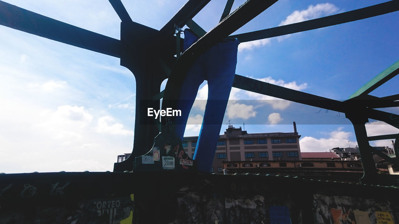 LOW ANGLE VIEW OF SUSPENSION BRIDGE AGAINST SKY