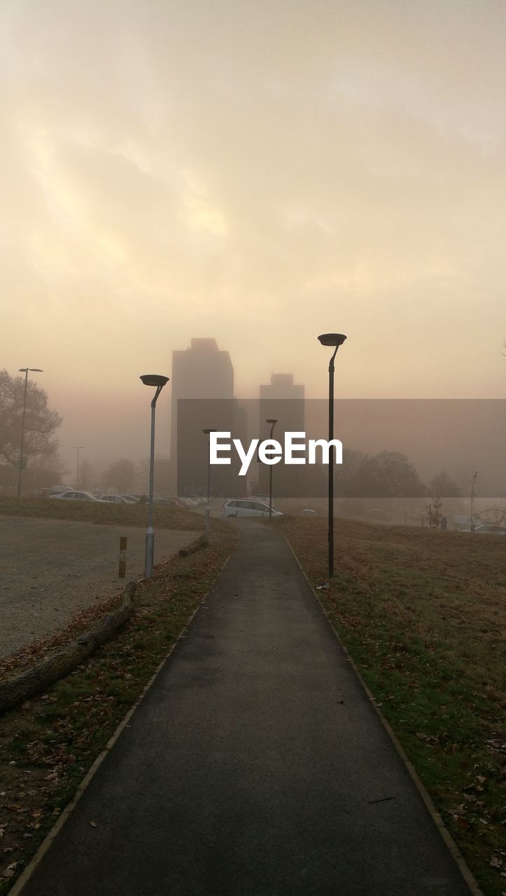 SCENIC VIEW OF FOGGY LANDSCAPE AGAINST SKY