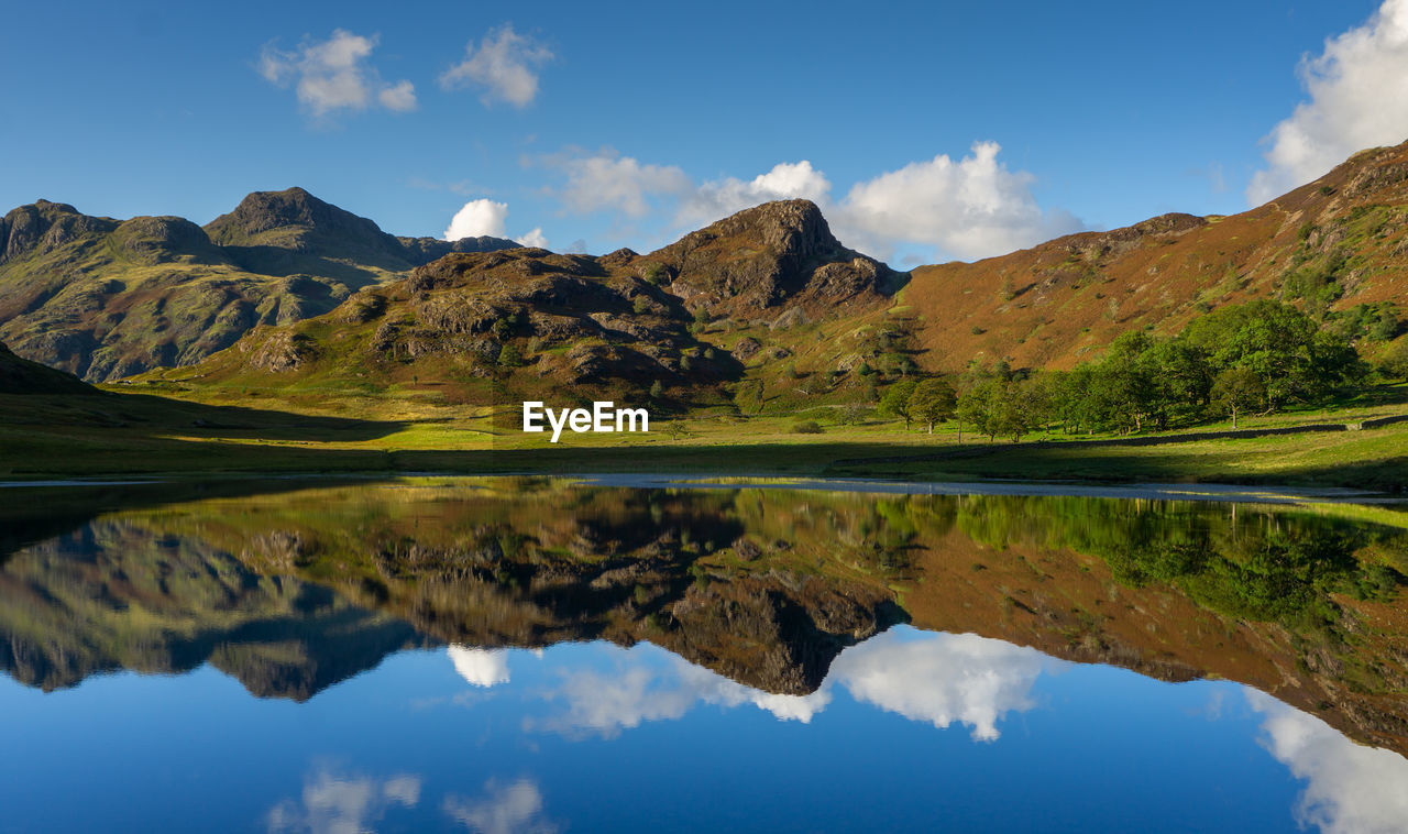 Reflections of the langdales in blea tarn in the english lake district, uk