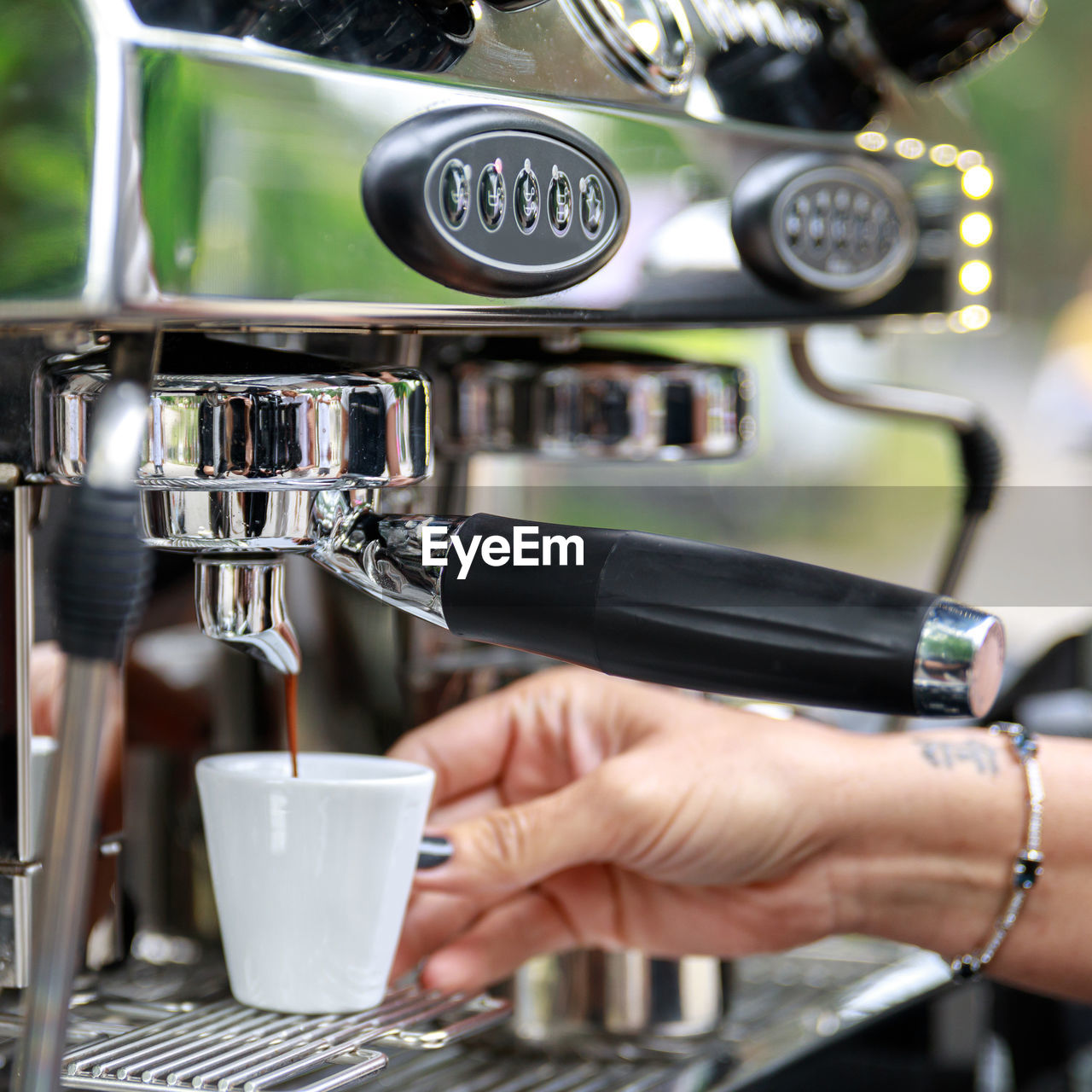 close-up of coffee pouring in cafe