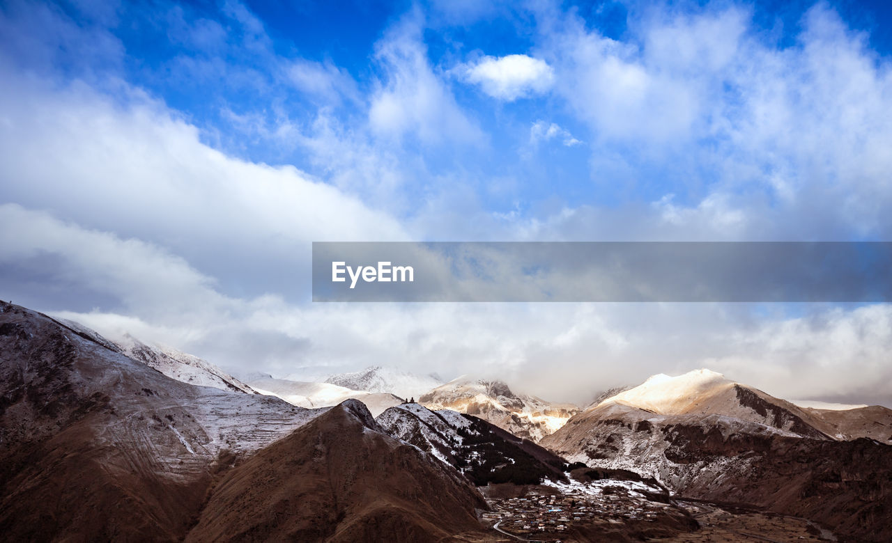 Scenic view of snowcapped mountains against sky